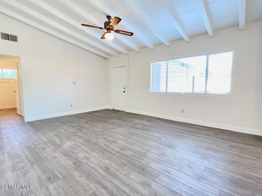 4120 Hi Drive Simi Valley, CA 93063 - Photo 5 of 29 an empty room with wooden floor chandelier fan and windows