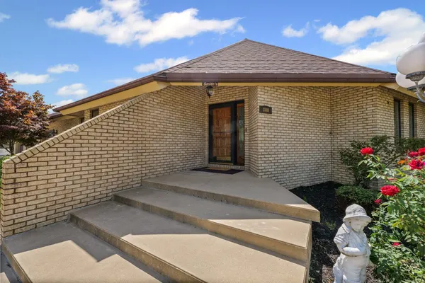 a front view of a house with a garage