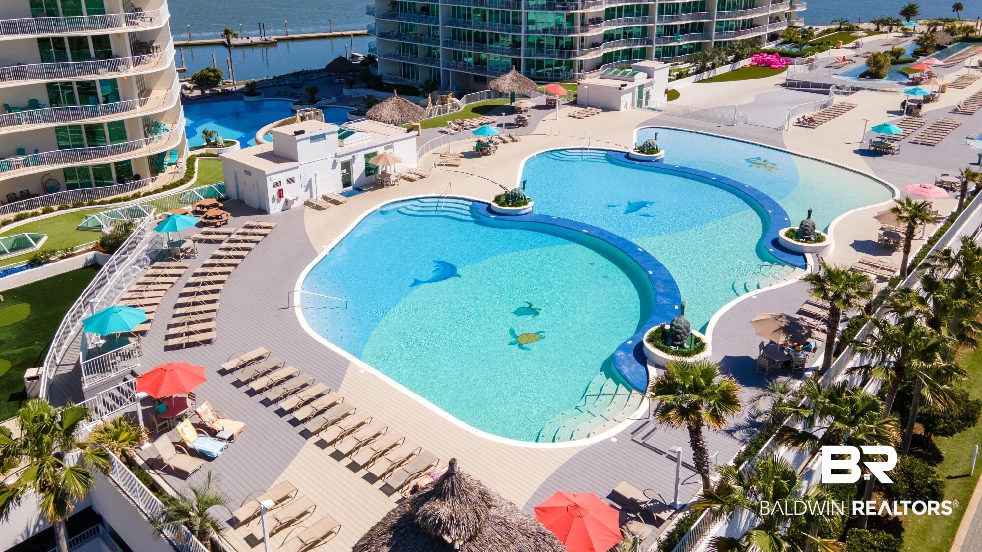 28107 Perdido Beach Boulevard, Unit DPH05 Orange Beach, AL 36561 - Photo 34 of 43 Community pool with a patio area and a water view