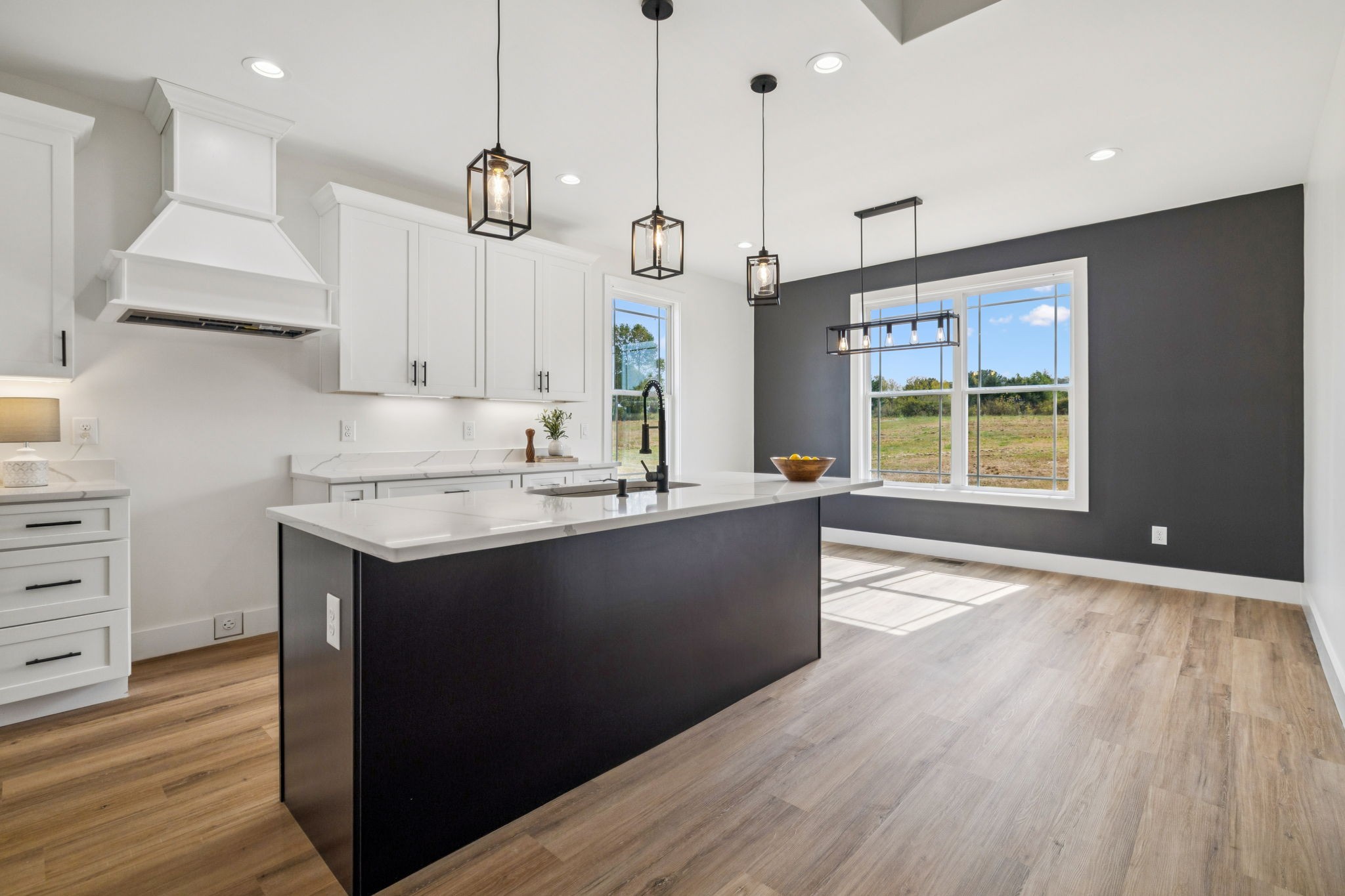 6437 Hopewell Road Springfield, TN 37172 - Photo 18 of 87 a kitchen with kitchen island granite countertop a stove a sink a center island and wooden floor