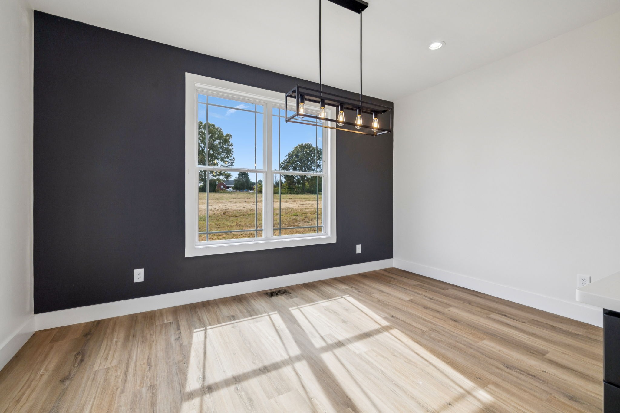 6437 Hopewell Road Springfield, TN 37172 - Photo 29 of 87 a view of an empty room with wooden floor and a window