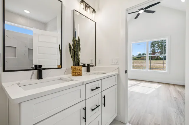 a bathroom with a bathtub and a shower