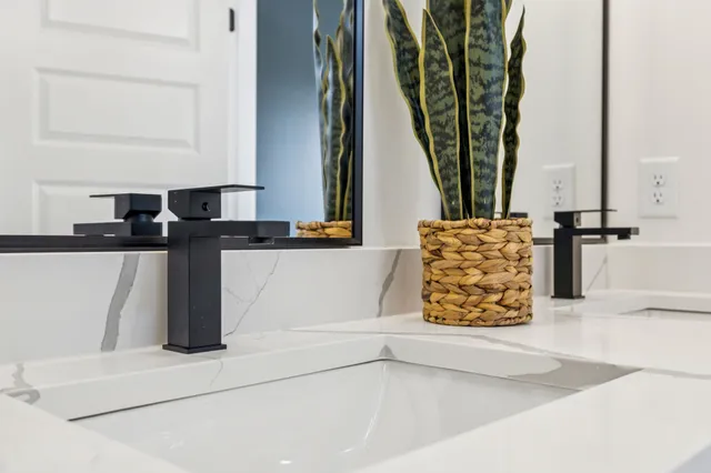 a bathroom with a toilet a sink and shower