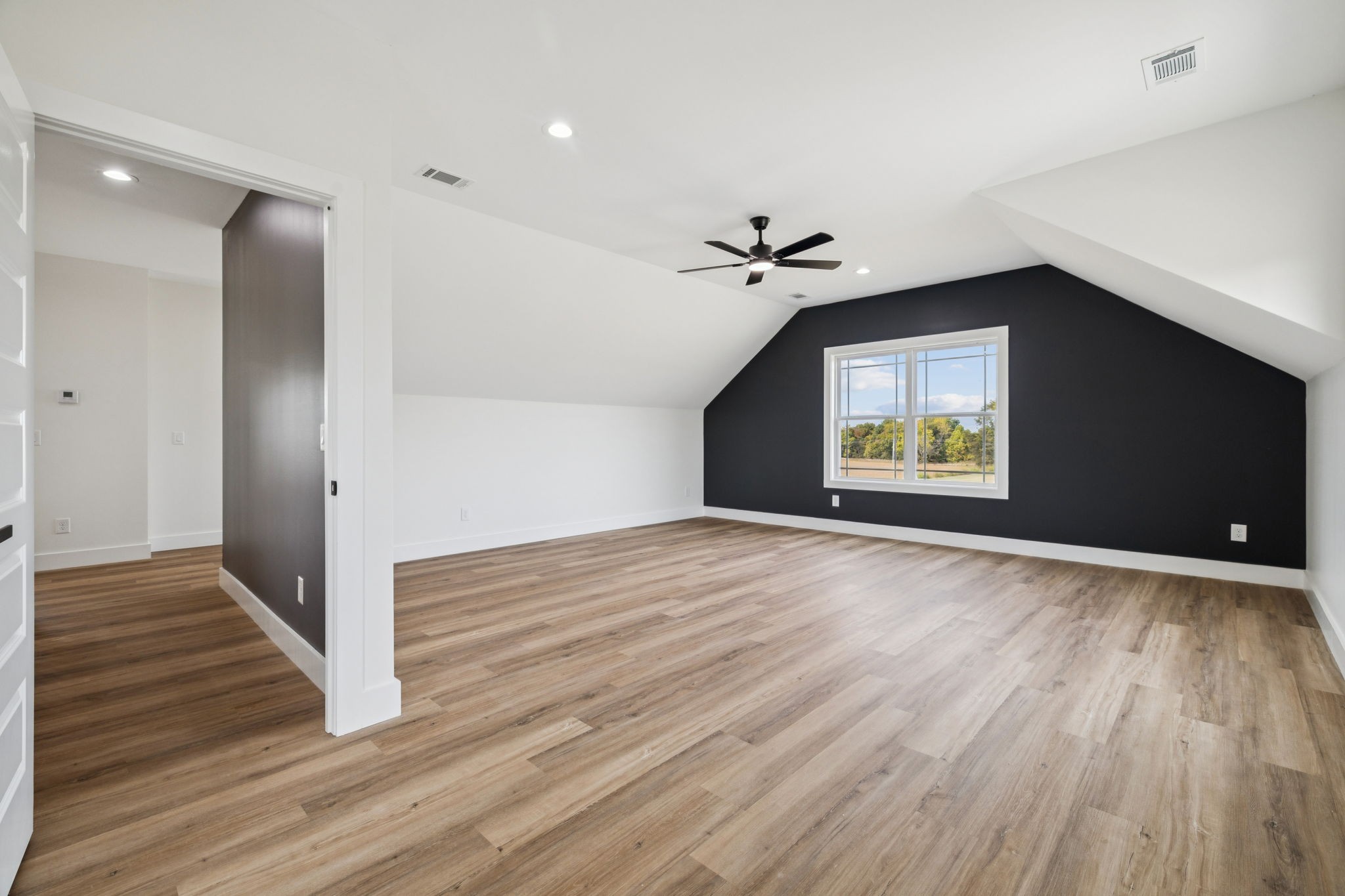 6437 Hopewell Road Springfield, TN 37172 - Photo 66 of 87 a view of an empty room with wooden floor and a window