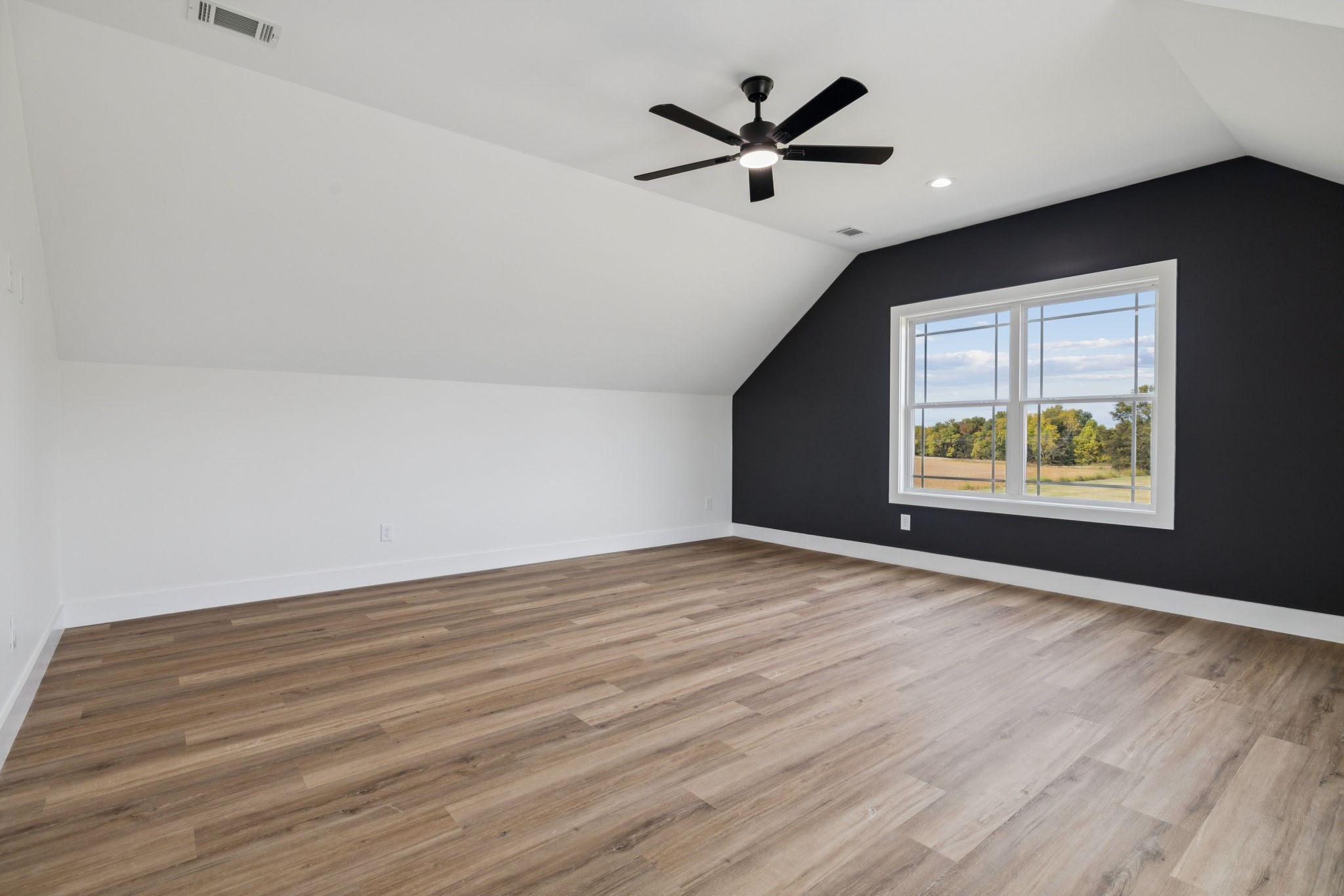6437 Hopewell Road Springfield, TN 37172 - Photo 67 of 87 an empty room with wooden floor and windows