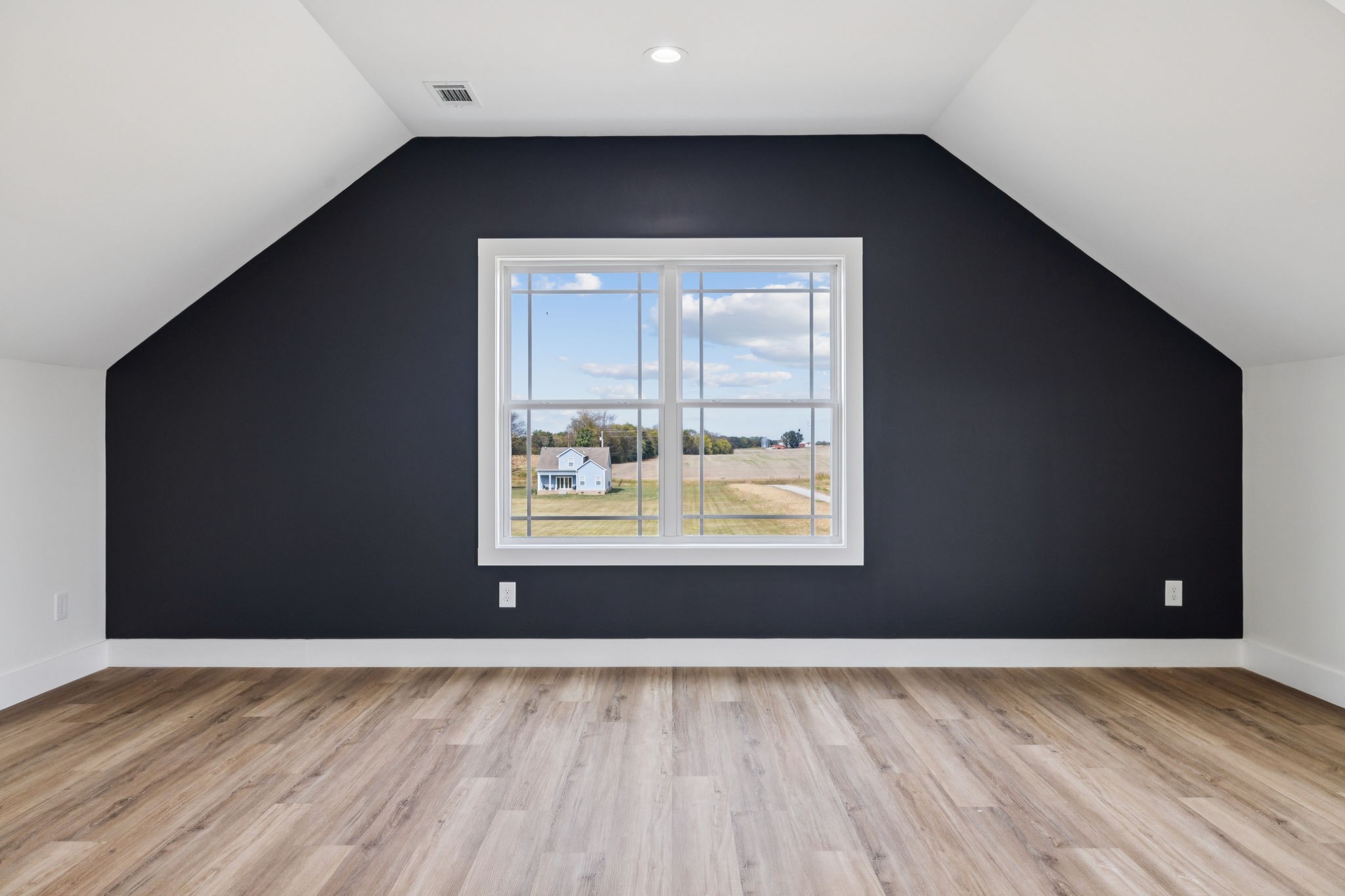 6437 Hopewell Road Springfield, TN 37172 - Photo 68 of 87 a view of an empty room with wooden floor and a window