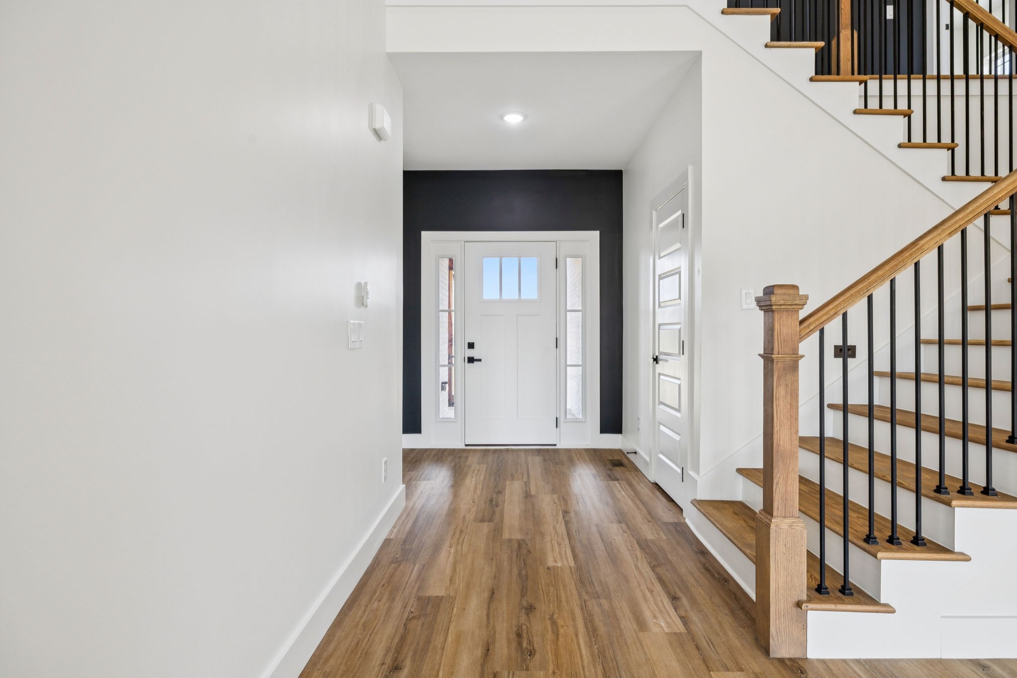 6437 Hopewell Road Springfield, TN 37172 - Photo 7 of 87 a view of a hallway with wooden floor and staircase