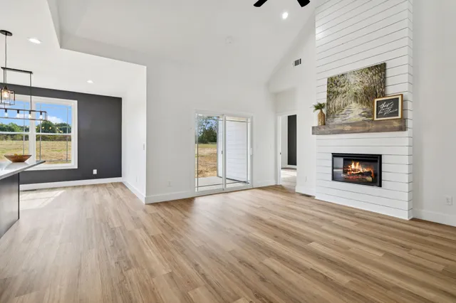 a living room with a fireplace and a fireplace