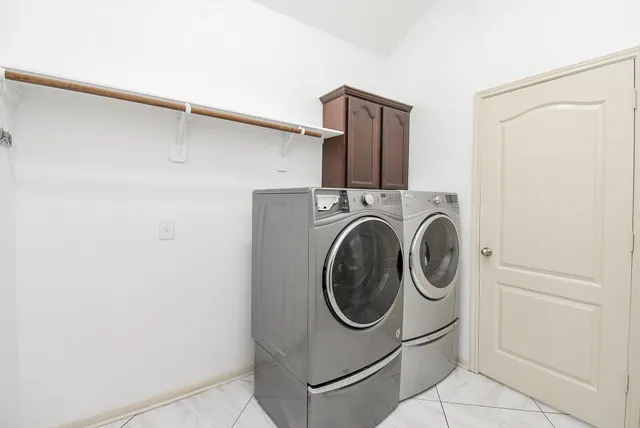 a utility room with dryer and washer