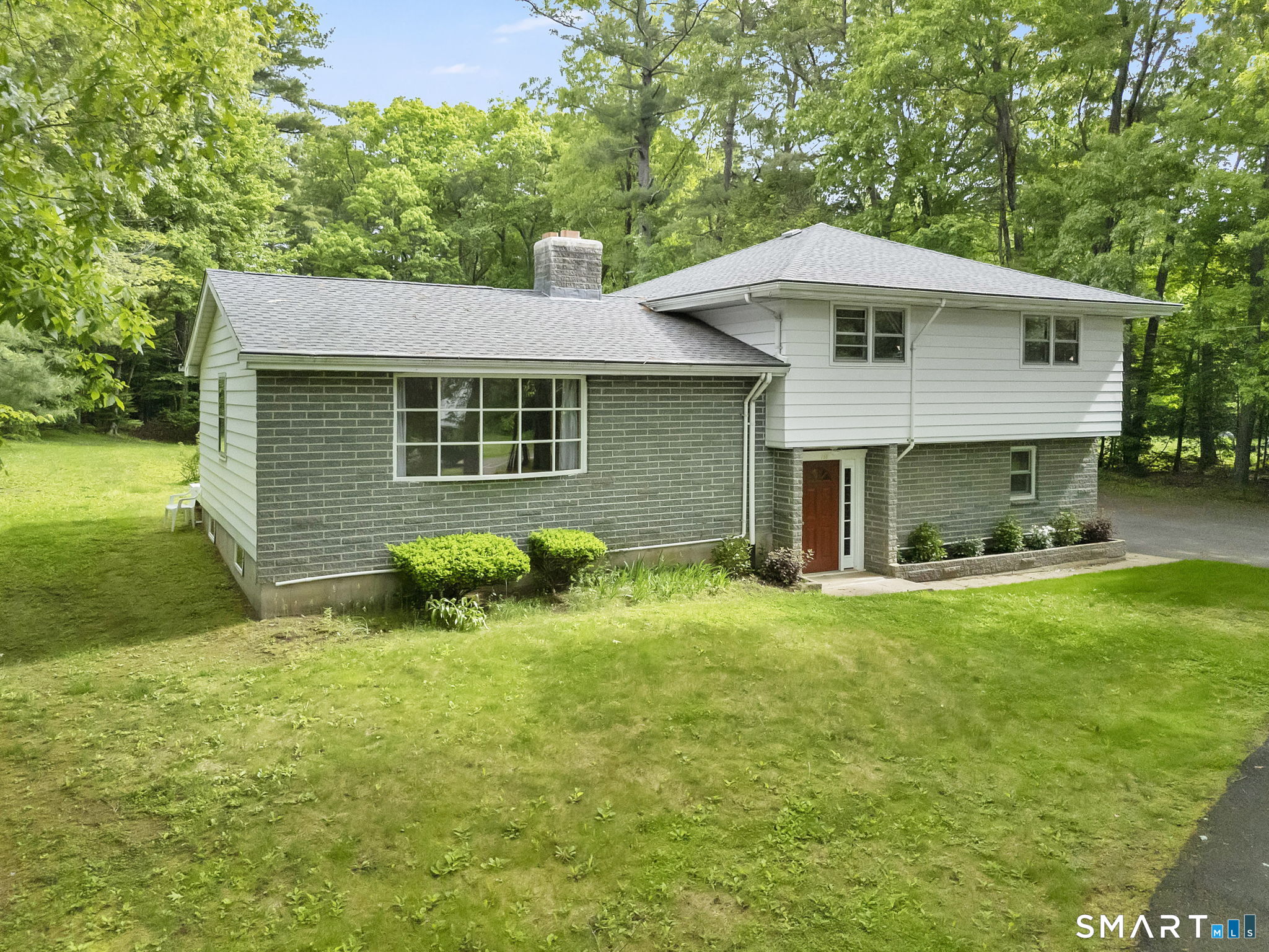 158 Notch Road Granby, CT 06035 - Photo 1 of 40 a view of a house with a yard and sitting area