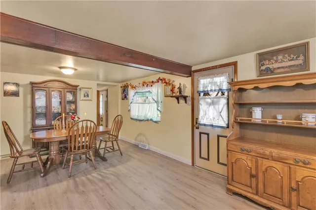a view of a kitchen and dining area with chandelier