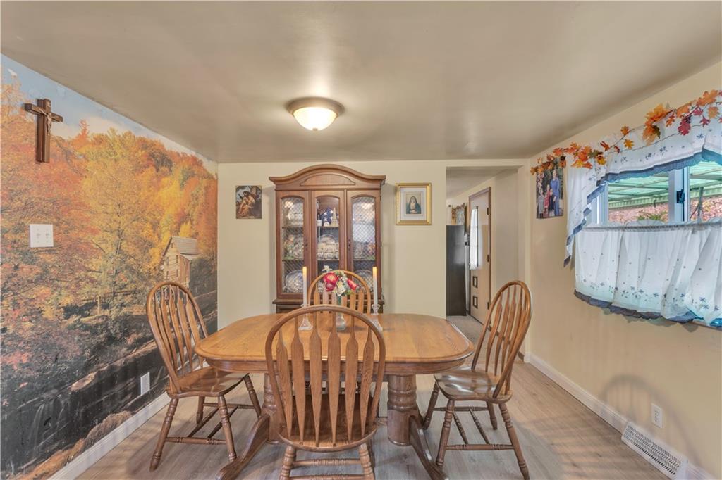 474 Exton Lake Road Apollo, PA 15613 - Photo 17 of 39 a view of a dining room with furniture and wooden floor