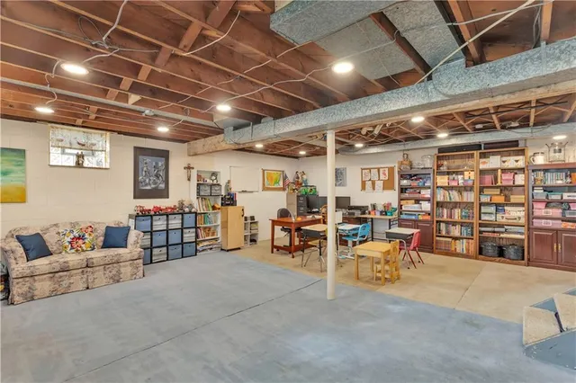 a living room with furniture and a store