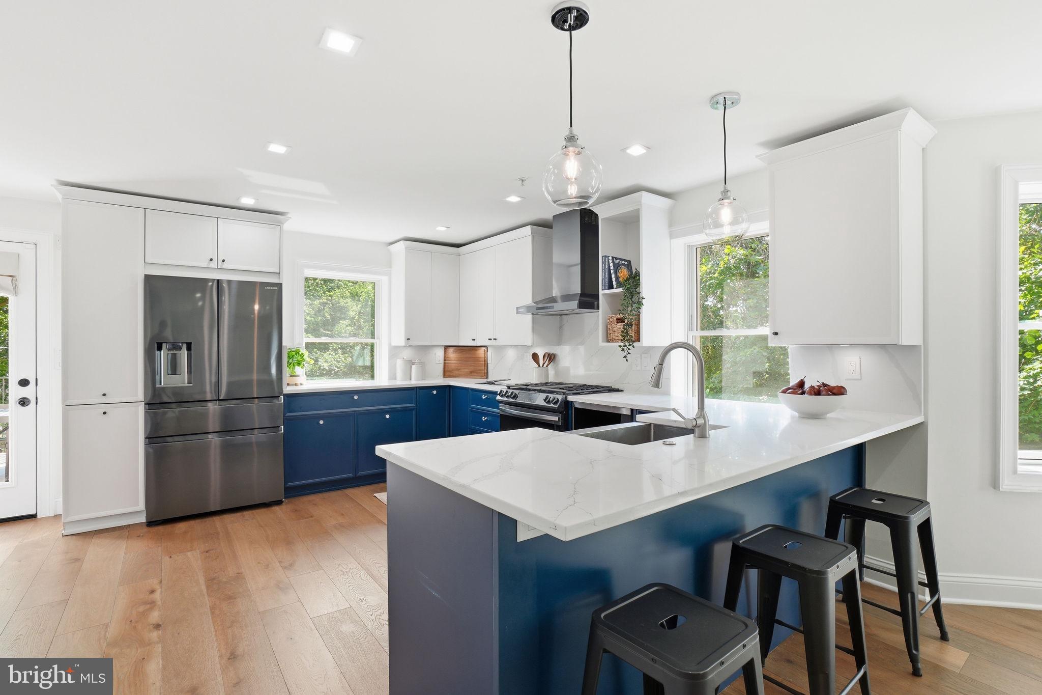 2800 Adams Mill Road Northwest, Unit 2 Washington, DC 20009 - Photo 12 of 32 a kitchen with a refrigerator a sink appliances and cabinets