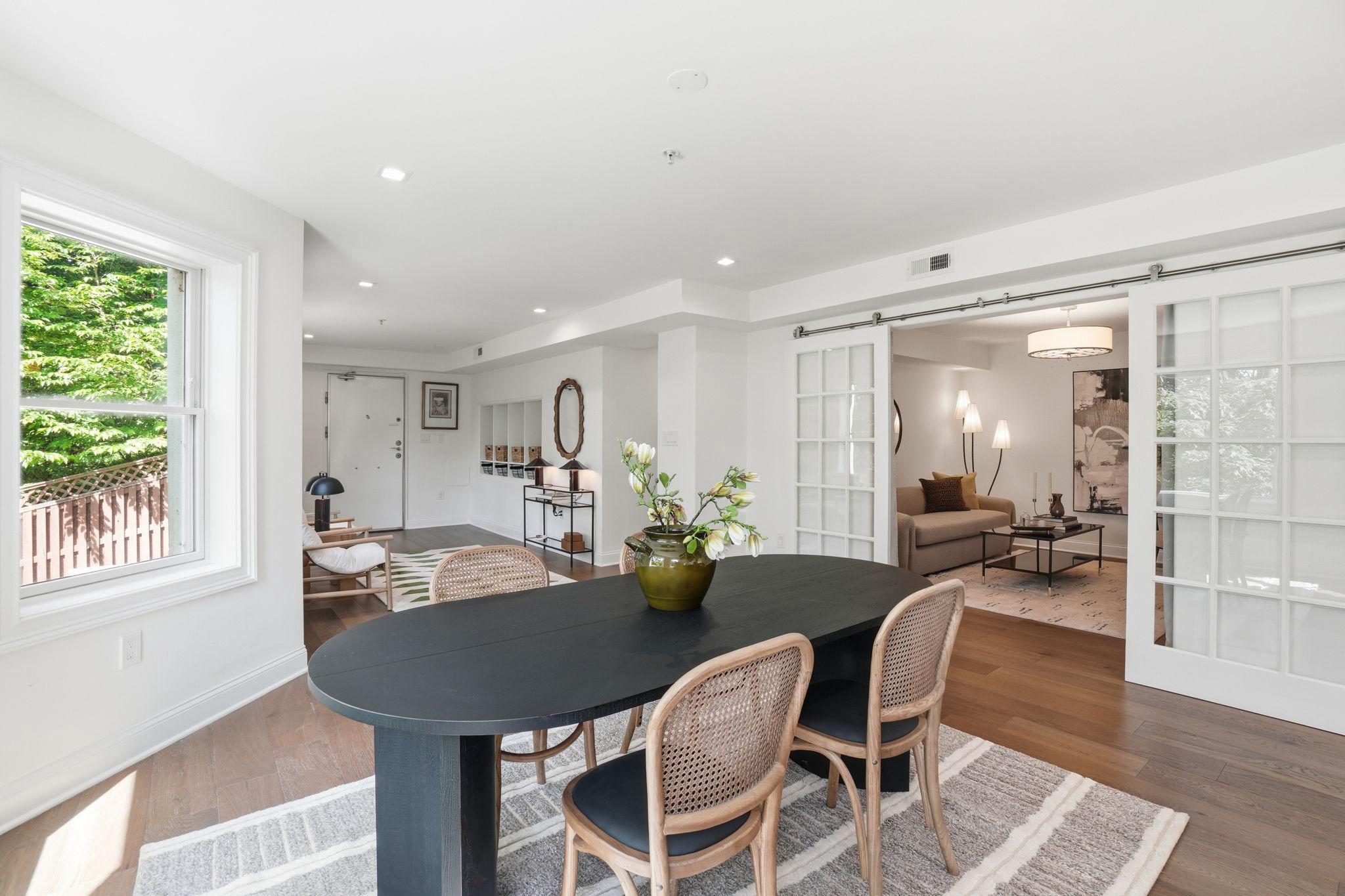 2800 Adams Mill Road Northwest, Unit 2 Washington, DC 20009 - Photo 15 of 32 a view of a dining room with furniture and wooden floor