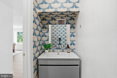 a bathroom with a sink and a mirror