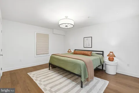 a bedroom with a bed and a table