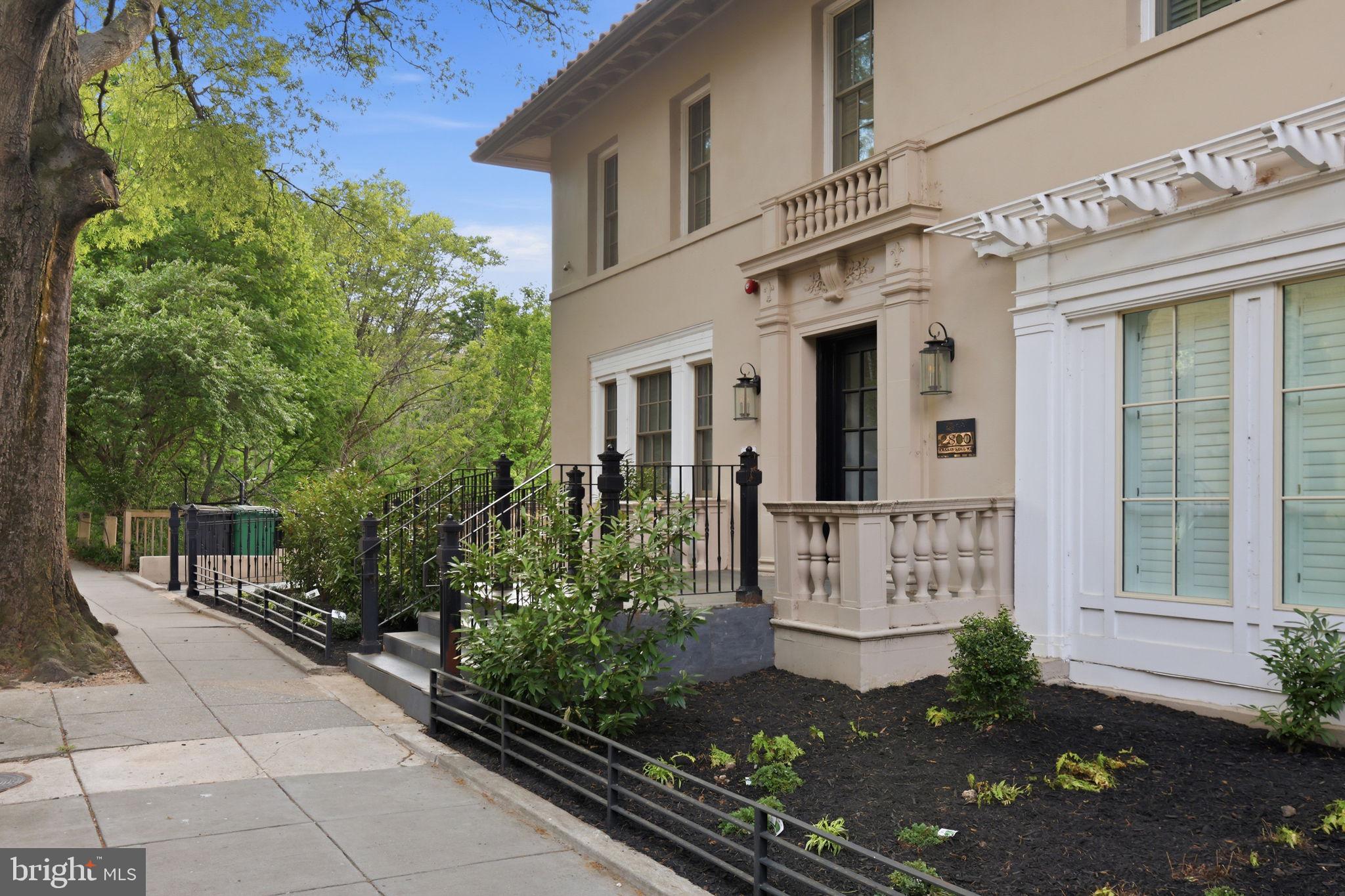2800 Adams Mill Road Northwest, Unit 2 Washington, DC 20009 - Photo 4 of 32 a front view of a house with a garden