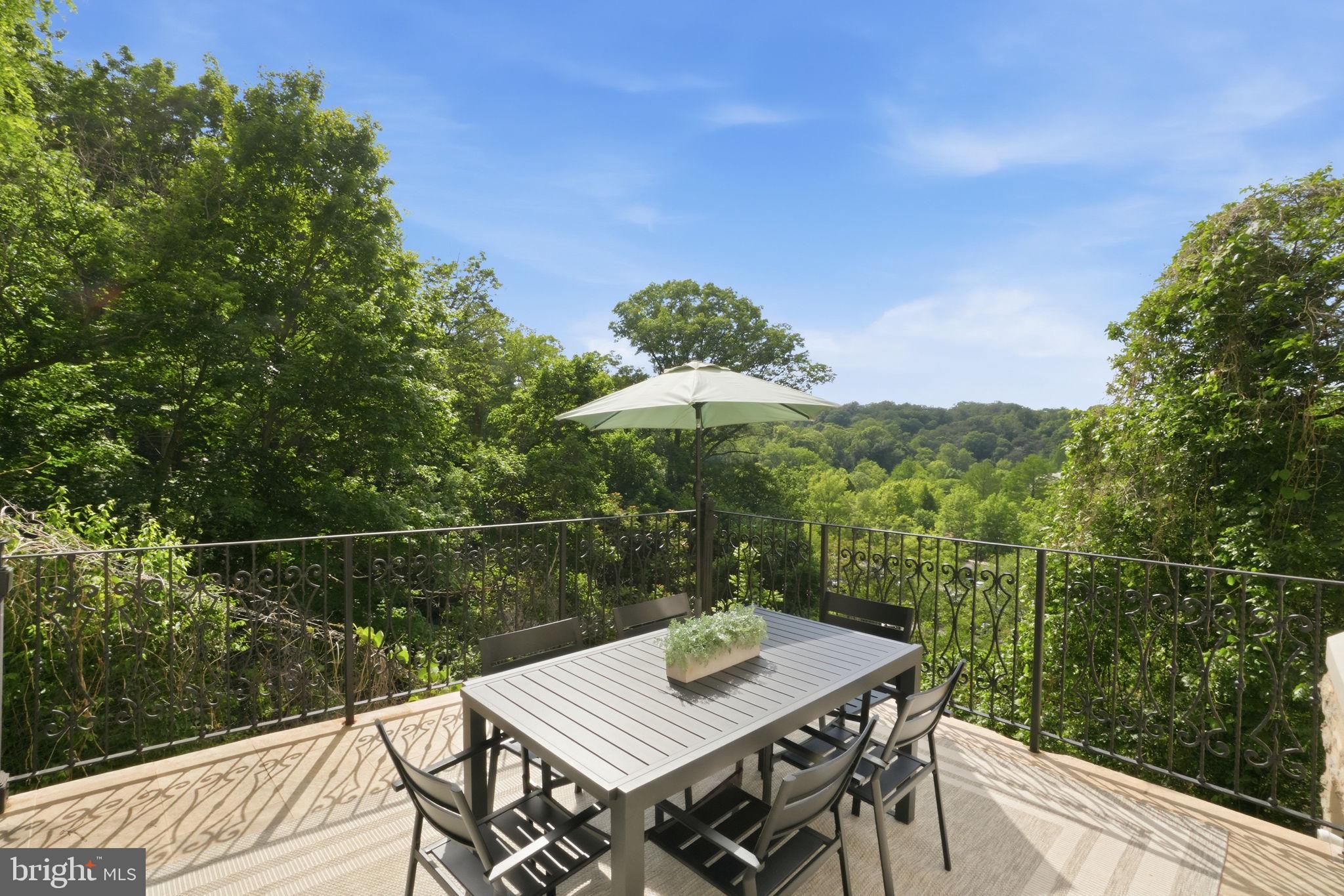 2800 Adams Mill Road Northwest, Unit 2 Washington, DC 20009 - Photo 5 of 32 a view of a balcony with mountain view and wooden floor