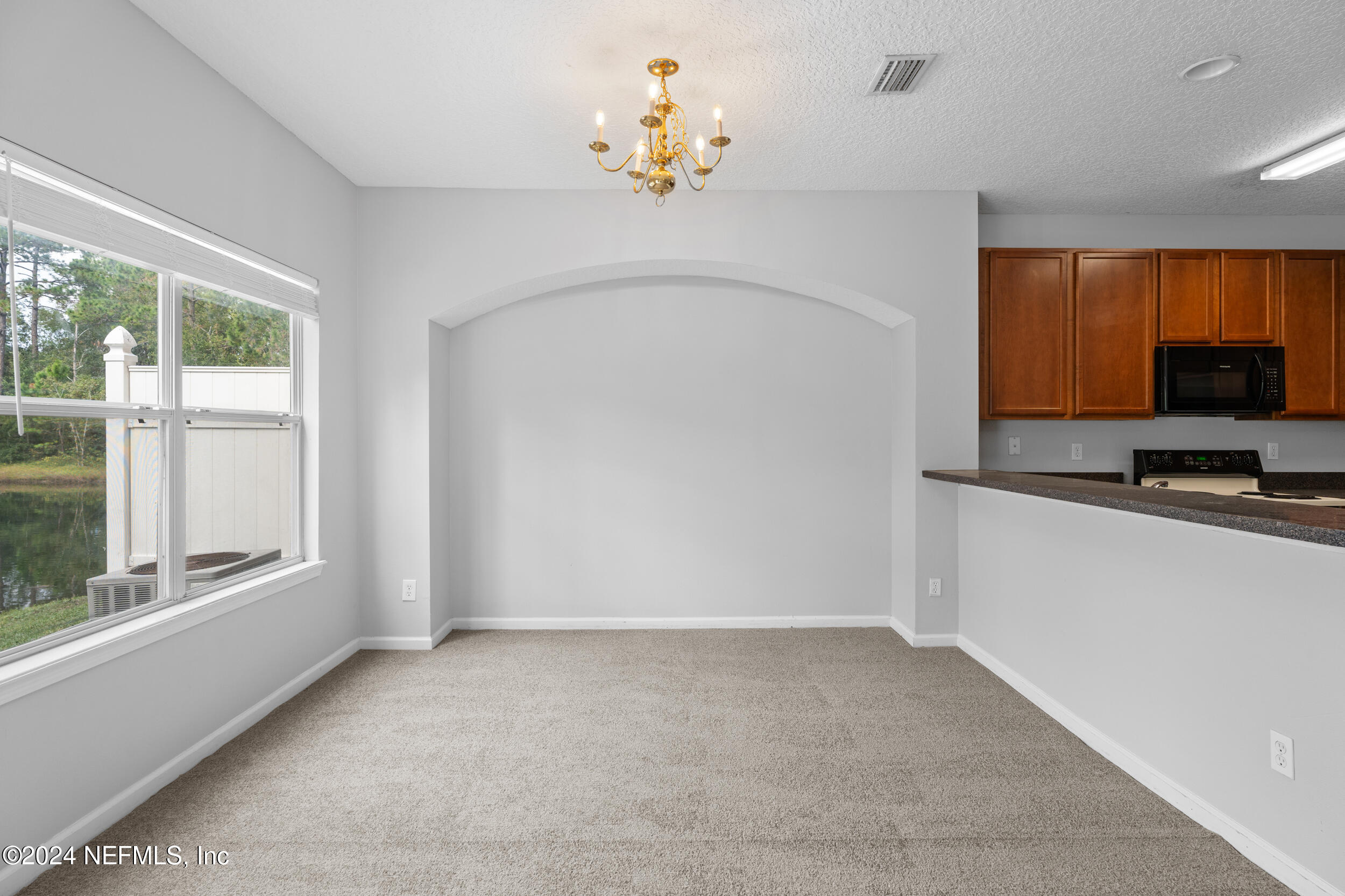 5260 Collins Road, Unit 1101 Jacksonville, FL 32244 - Photo 18 of 25 a very nice looking room with a large window