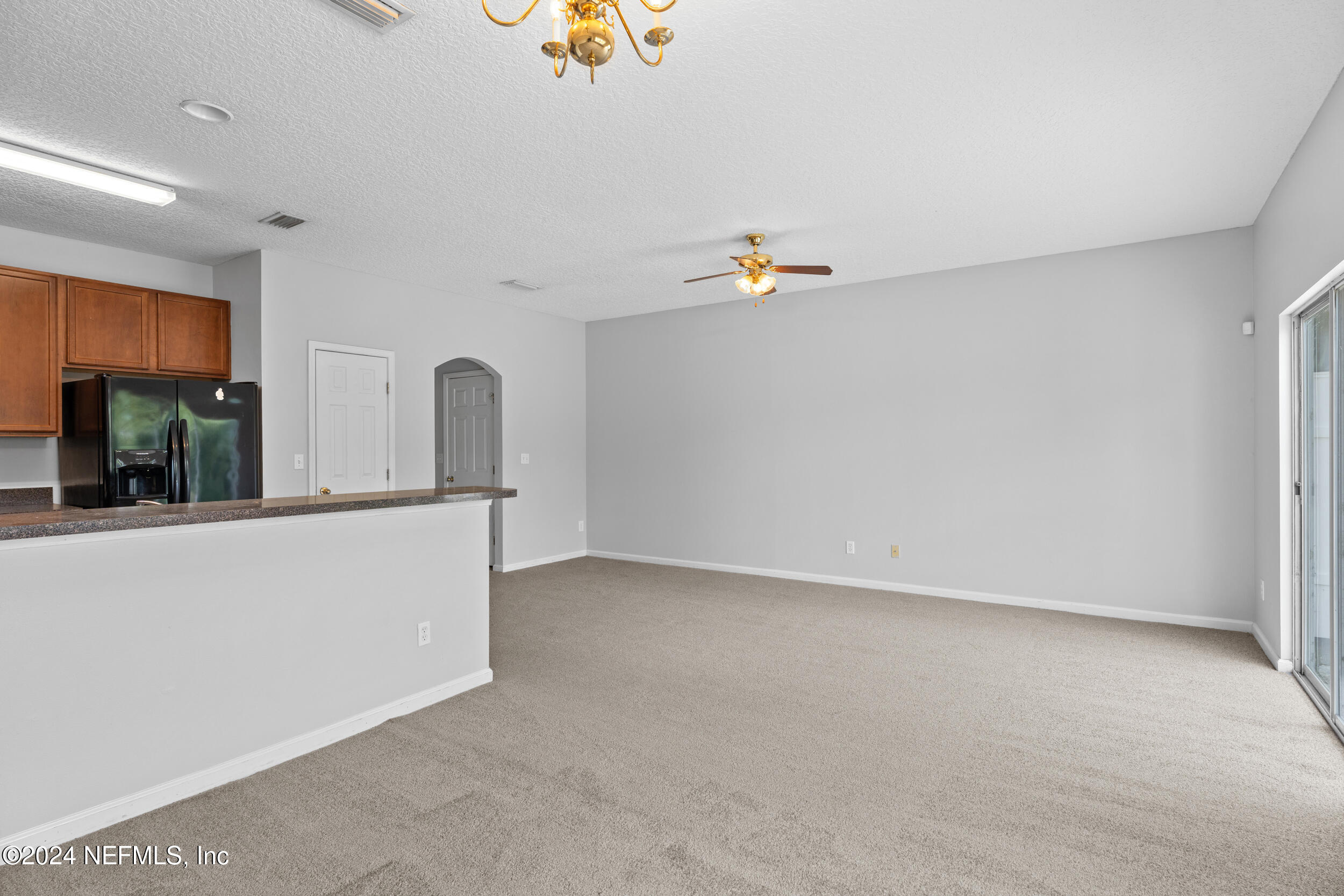 5260 Collins Road, Unit 1101 Jacksonville, FL 32244 - Photo 19 of 25 a view of an empty room with window