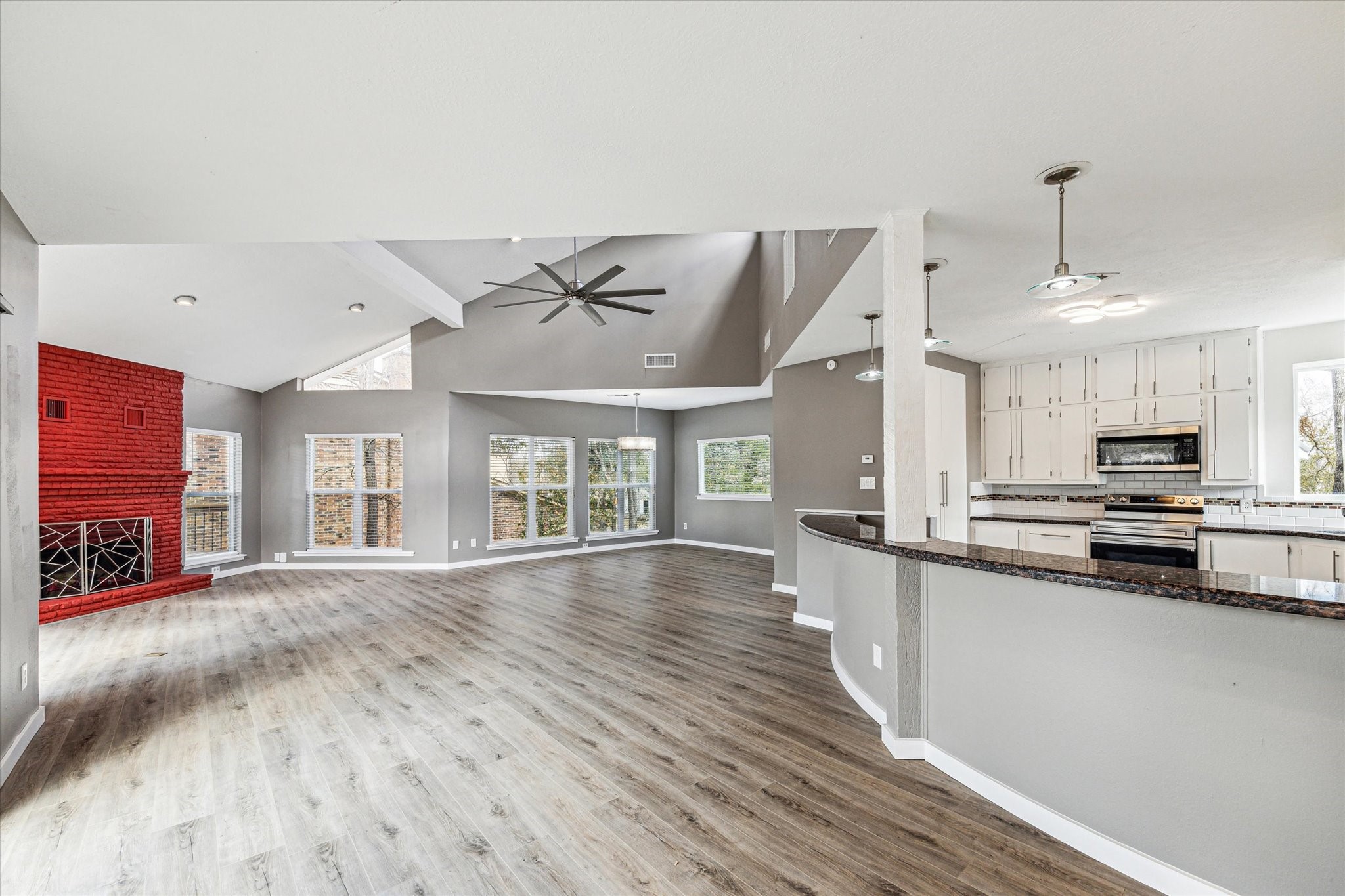 146 Dawns Edge Conroe, TX 77356 - Photo 15 of 39 a large kitchen with cabinets a sink and a stove top oven