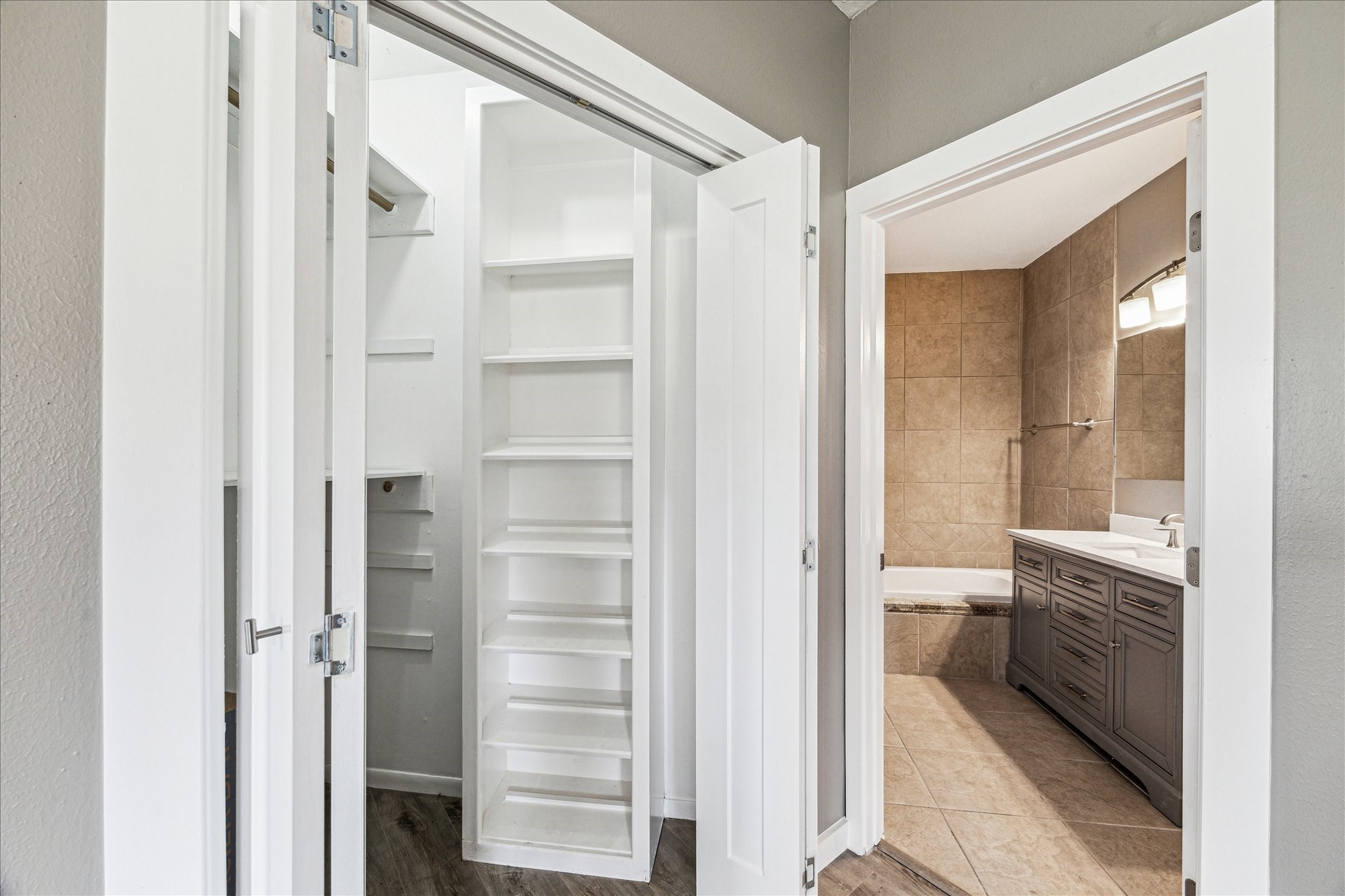 146 Dawns Edge Conroe, TX 77356 - Photo 21 of 39 a bathroom with a glass door shower