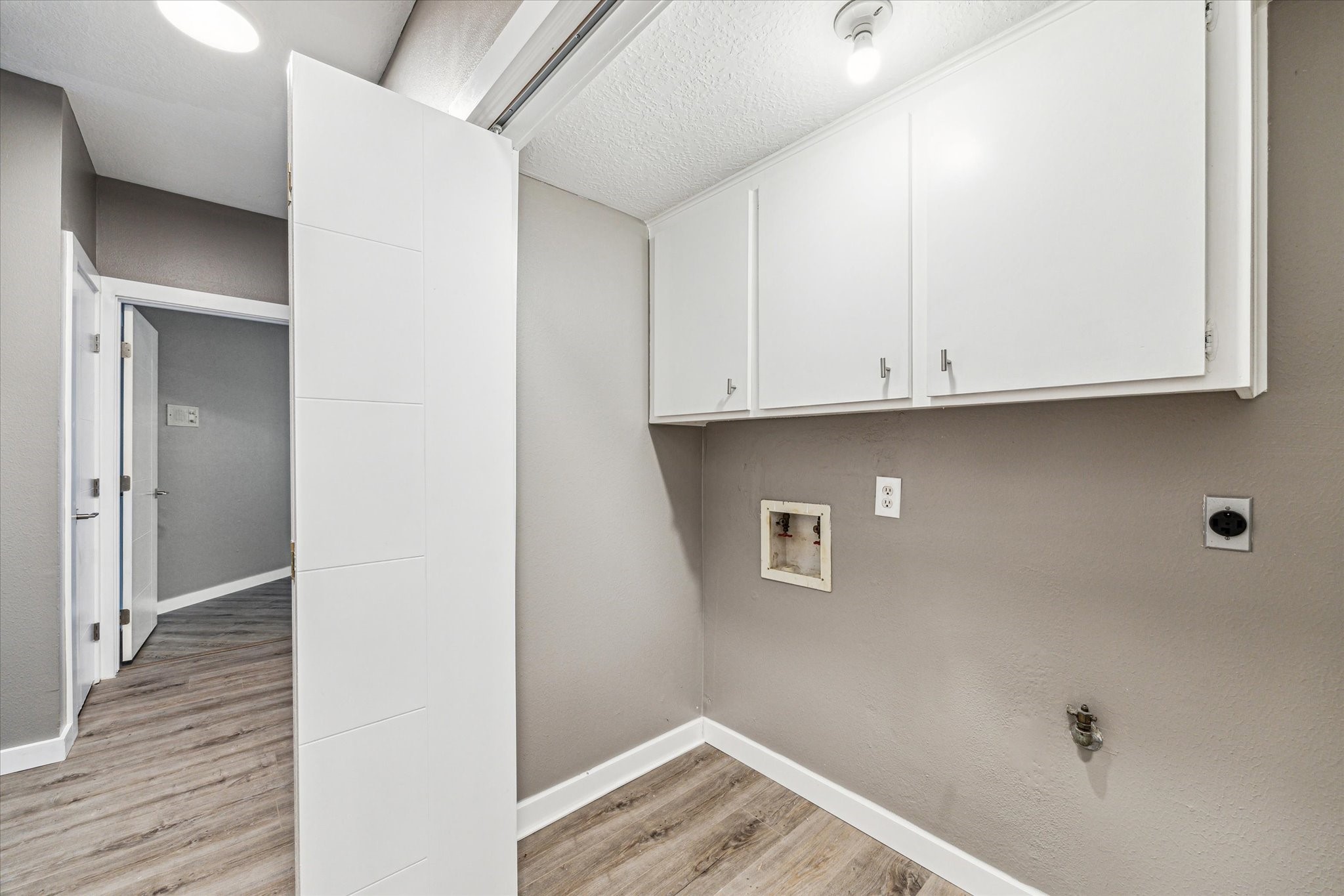 146 Dawns Edge Conroe, TX 77356 - Photo 28 of 39 a view of storage and utility room with wooden floor