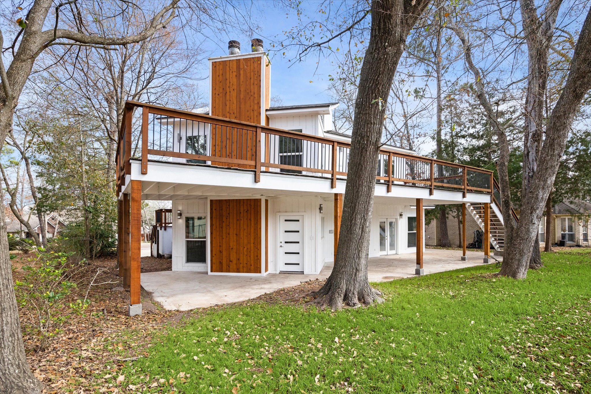 146 Dawns Edge Conroe, TX 77356 - Photo 37 of 39 a view of a house with a yard and a large tree