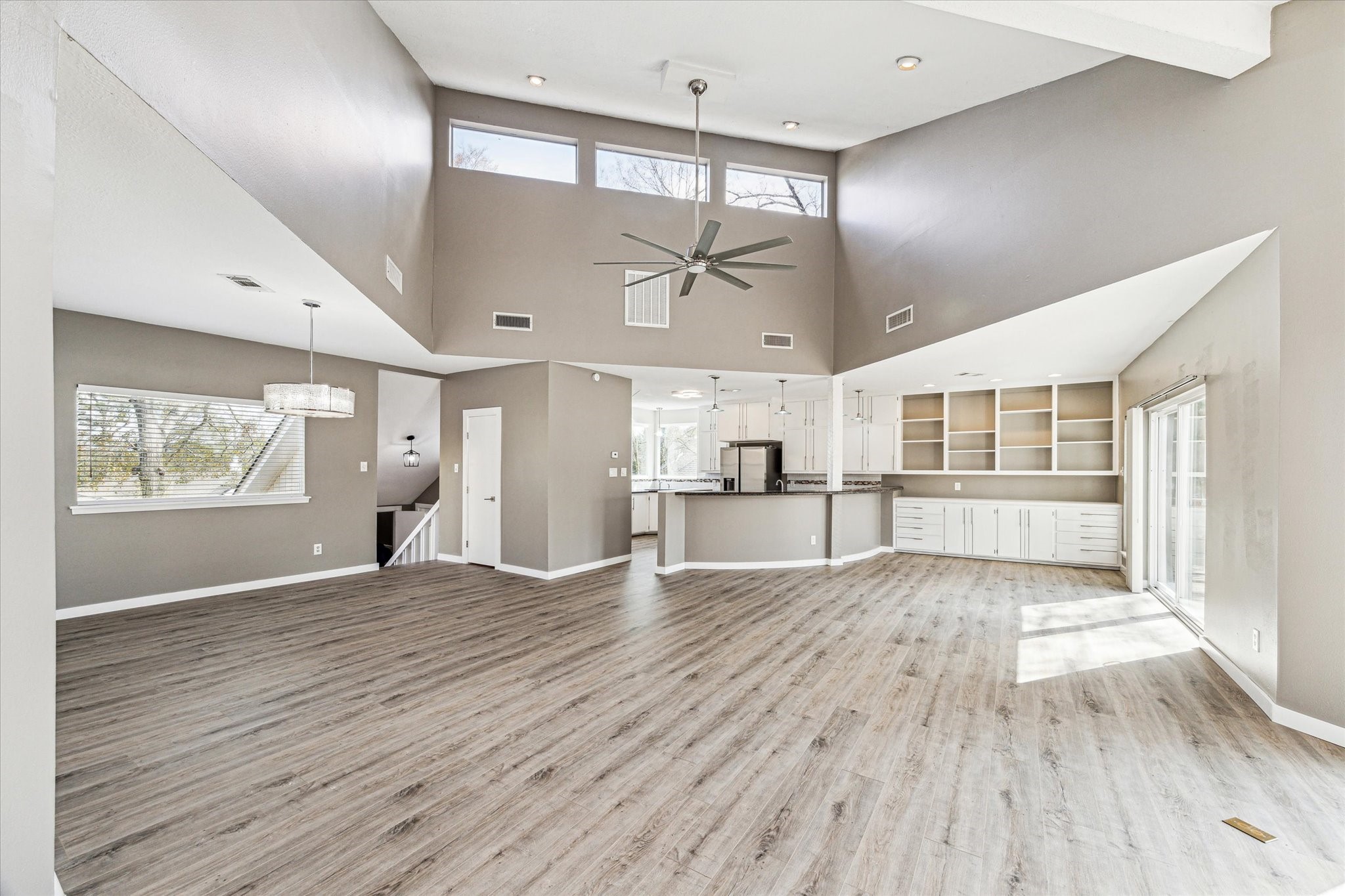 146 Dawns Edge Conroe, TX 77356 - Photo 9 of 39 a view of an empty room with wooden floor and a window