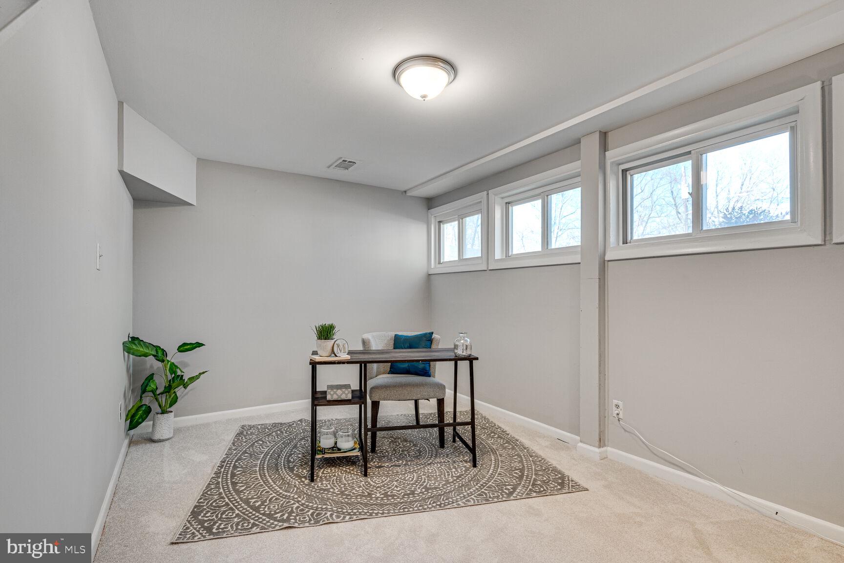 4310 Robert Court Silver Spring, MD 20906 - Photo 14 of 18 a workspace room with furniture and potted plant