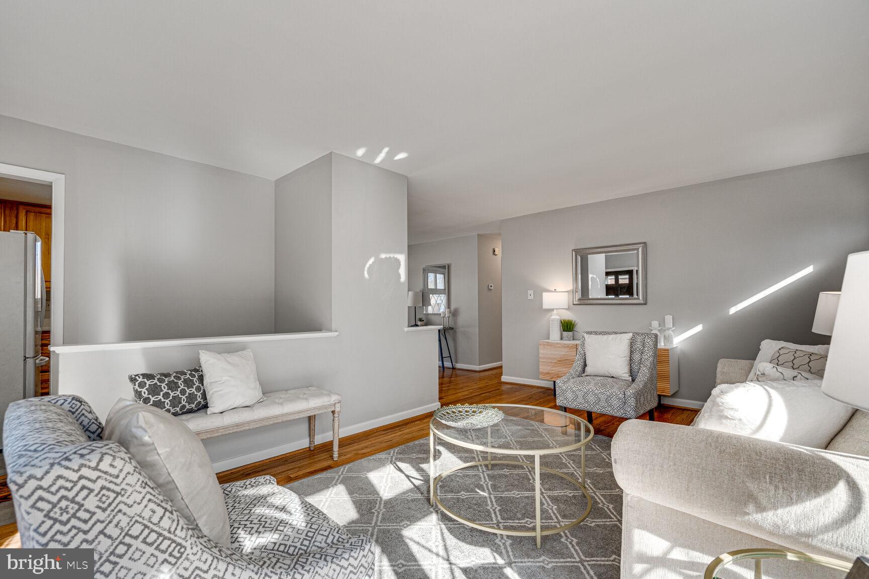 4310 Robert Court Silver Spring, MD 20906 - Photo 6 of 18 a living room with furniture a rug and a window