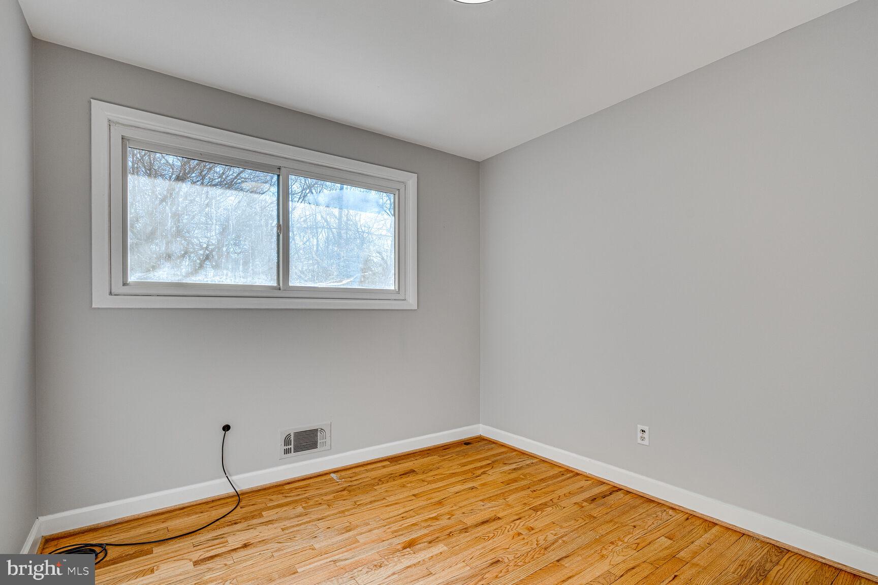 4310 Robert Court Silver Spring, MD 20906 - Photo 10 of 18 a view of empty room with window