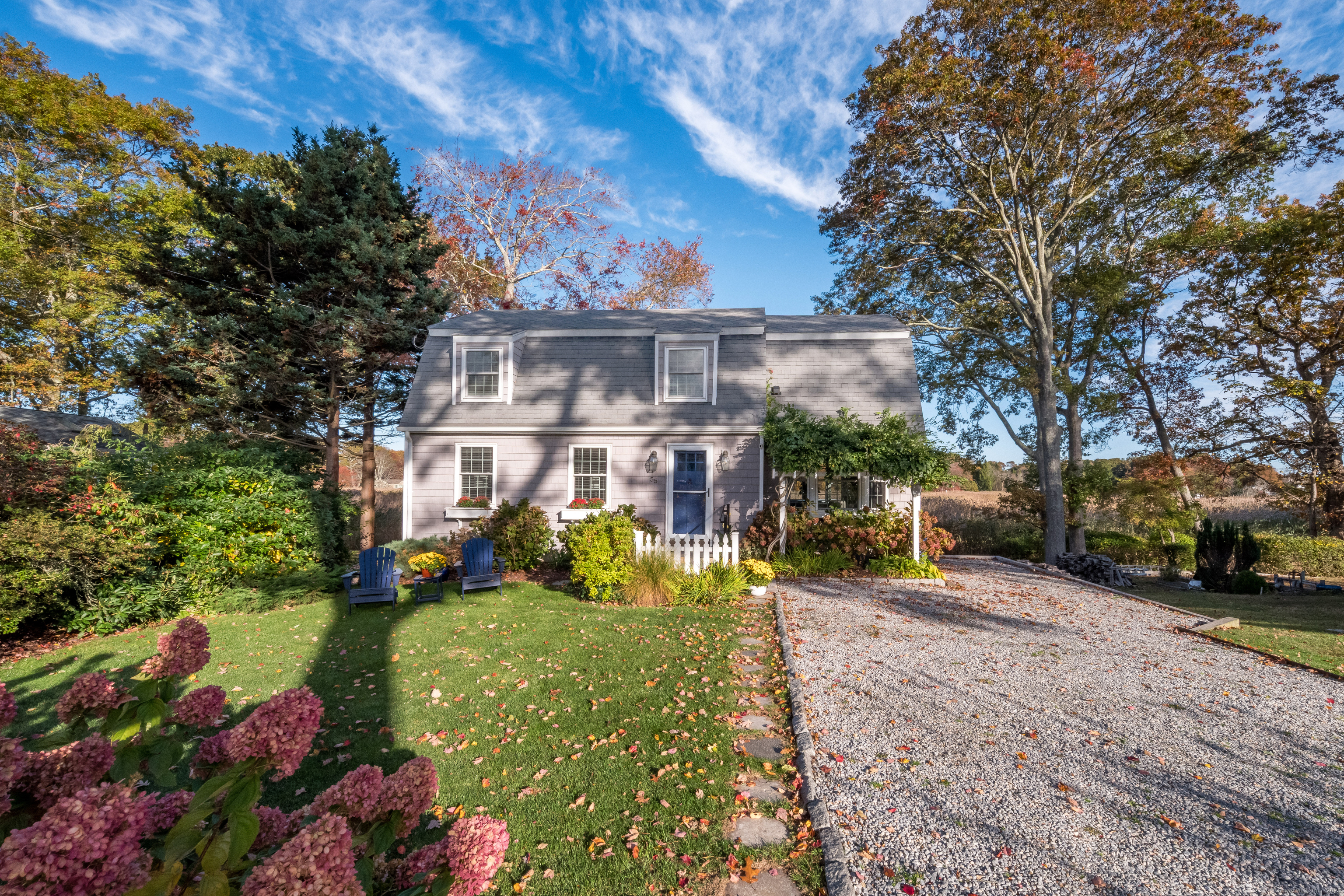 55 Cypress Road Old Saybrook, CT 06475 - Photo 1 of 1 a view of a house with a garden and pathway