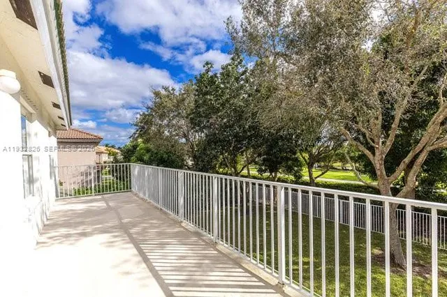 a bedroom with two beds and a flat screen tv