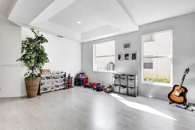 a very nice looking room with furniture and a window