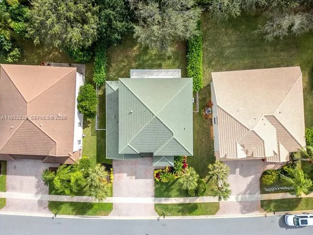 an aerial view of a house with a lake view