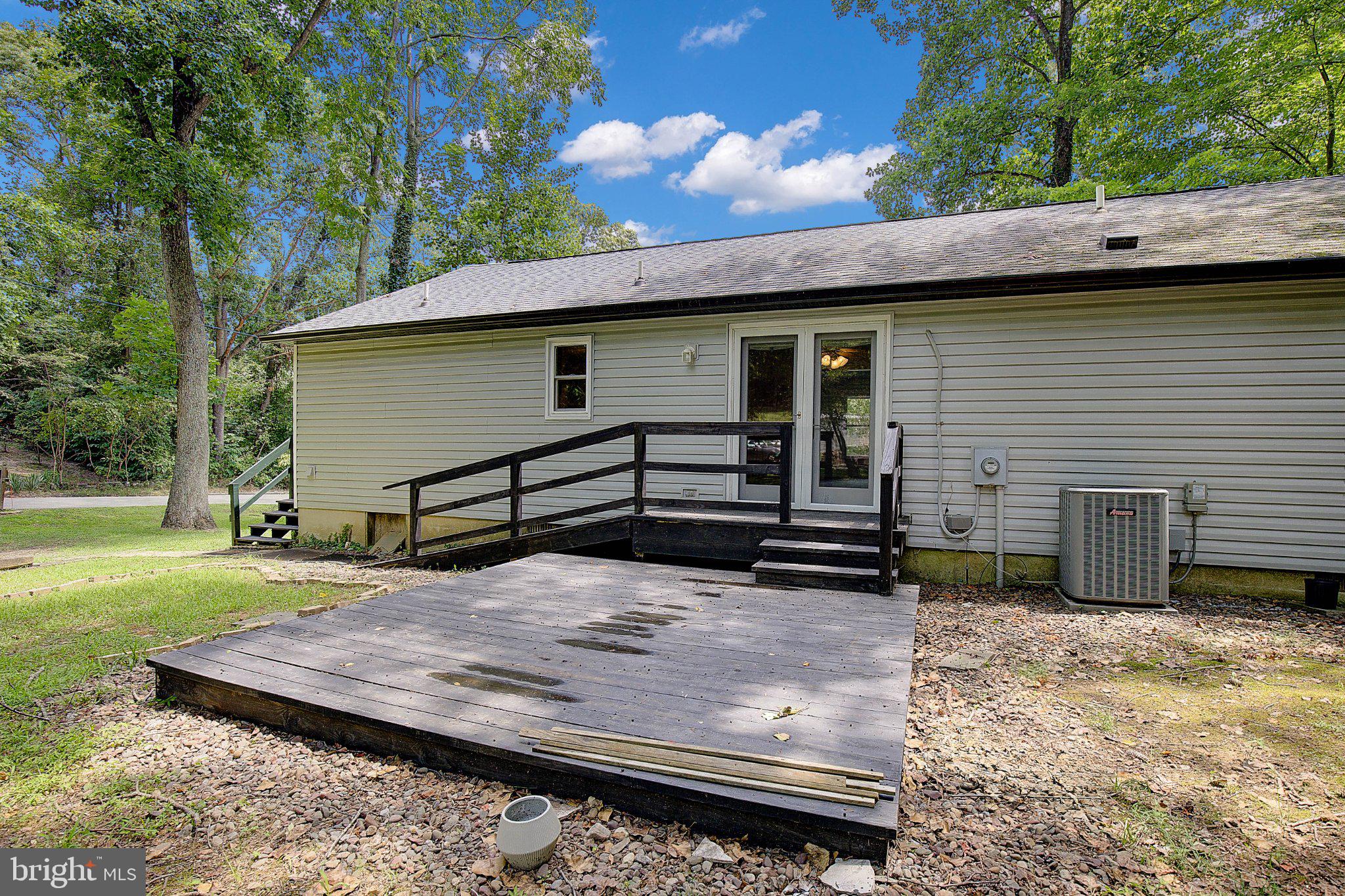 1111 Redeye Road Lusby, MD 20657 - Photo 4 of 24 Charming home with serene outdoor space.