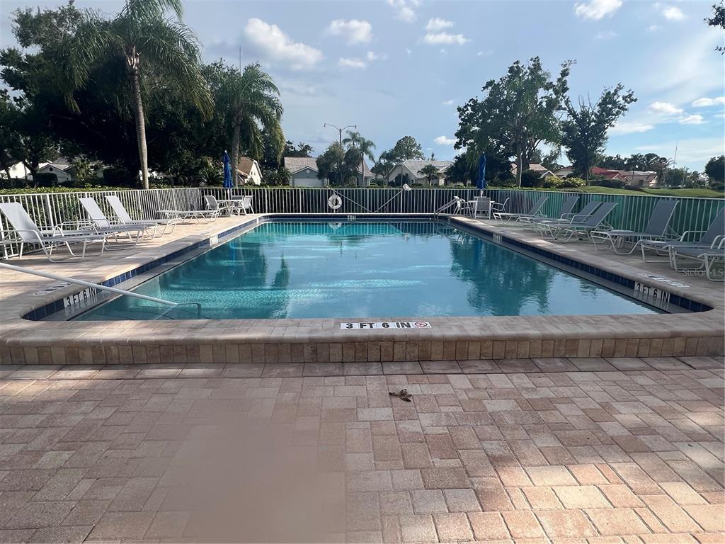 6501 Stone River Road, Unit 309 Bradenton, FL 34203 - Photo 11 of 30 a view of a backyard with swimming pool