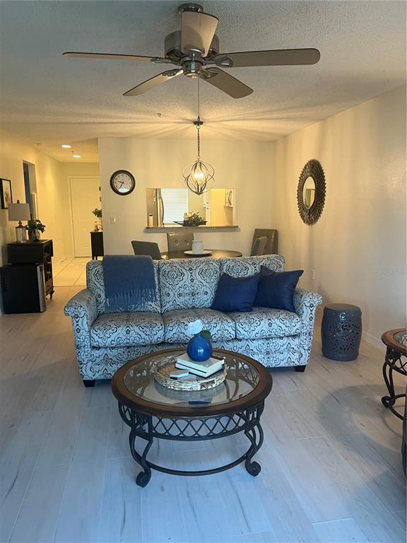 6501 Stone River Road, Unit 309 Bradenton, FL 34203 - Photo 12 of 30 a living room with furniture and a table