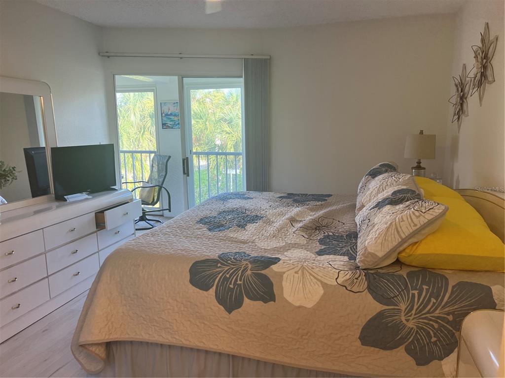 6501 Stone River Road, Unit 309 Bradenton, FL 34203 - Photo 20 of 30 a bedroom with a bed and window
