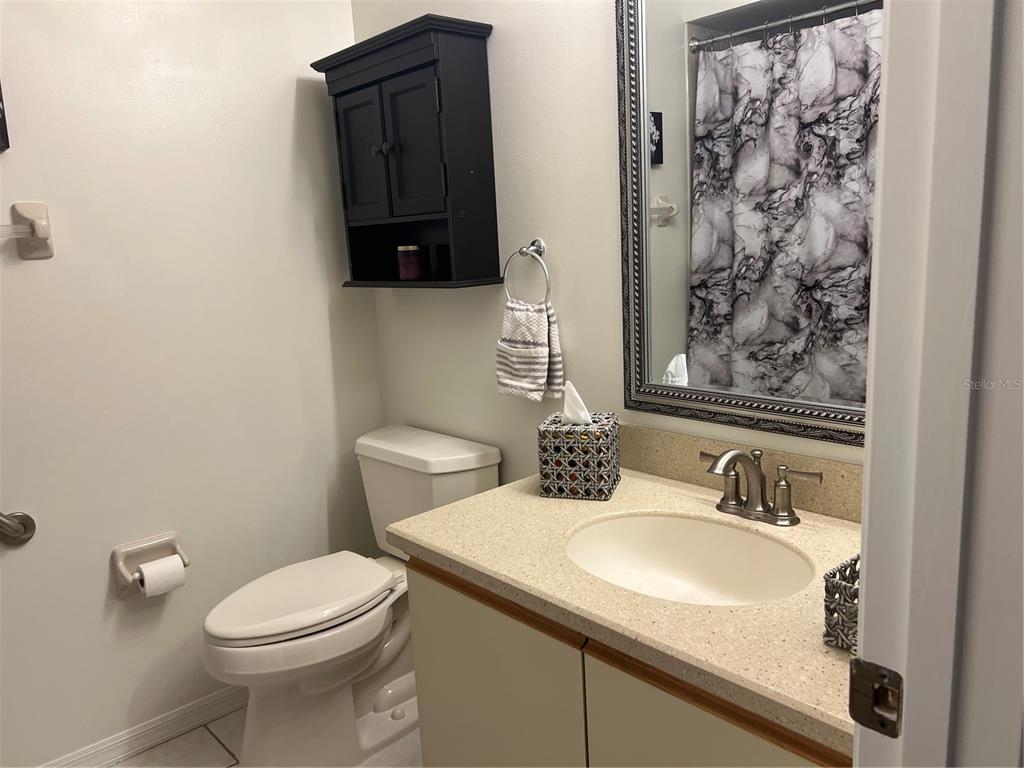 6501 Stone River Road, Unit 309 Bradenton, FL 34203 - Photo 27 of 30 a bathroom with a sink and a toilet