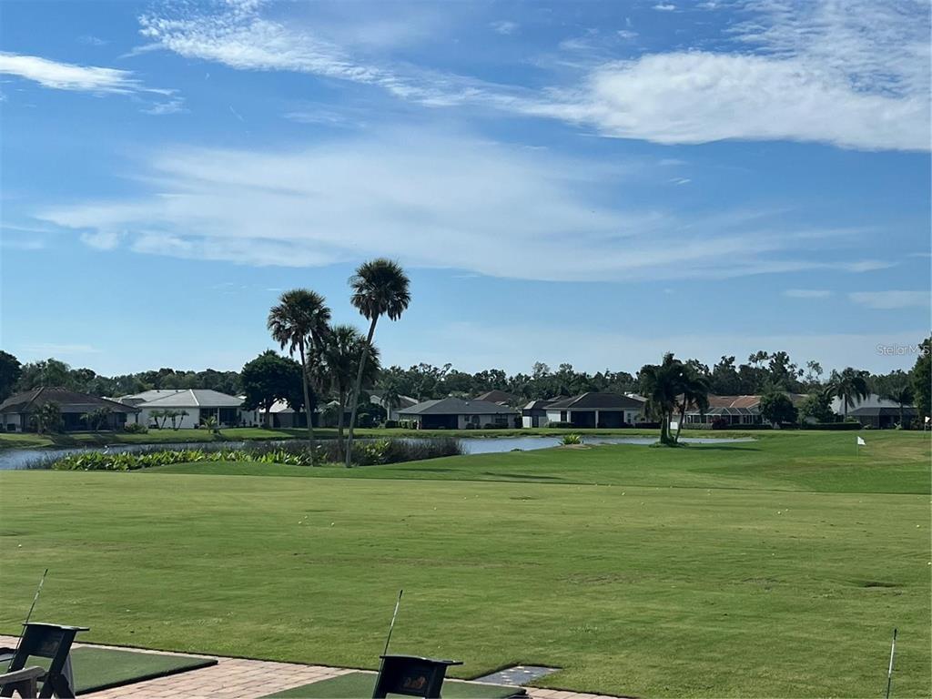 6501 Stone River Road, Unit 309 Bradenton, FL 34203 - Photo 7 of 30 a view of a lake with houses in the back