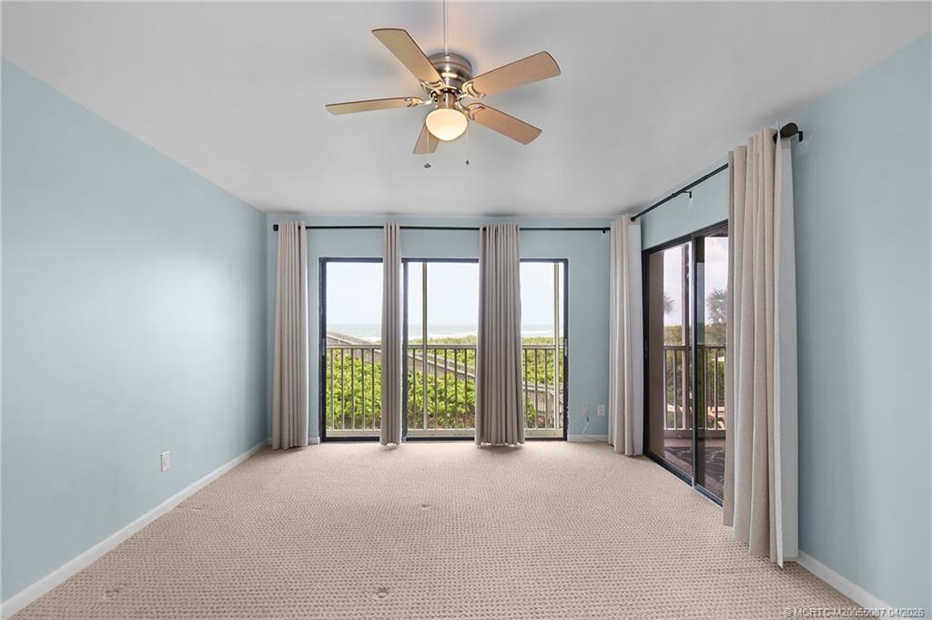 529 Northeast Plantation Road, Unit 105 Jensen Beach, FL 34957 - Photo 21 of 36 a view of an empty room with a window