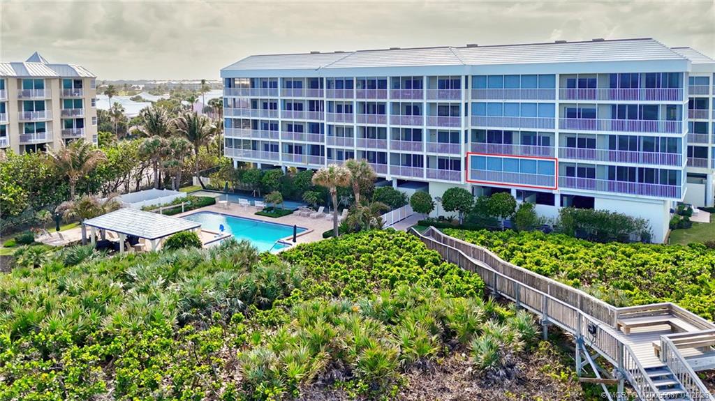 529 Northeast Plantation Road, Unit 105 Jensen Beach, FL 34957 - Photo 3 of 36 a view of a patio with plants and chairs