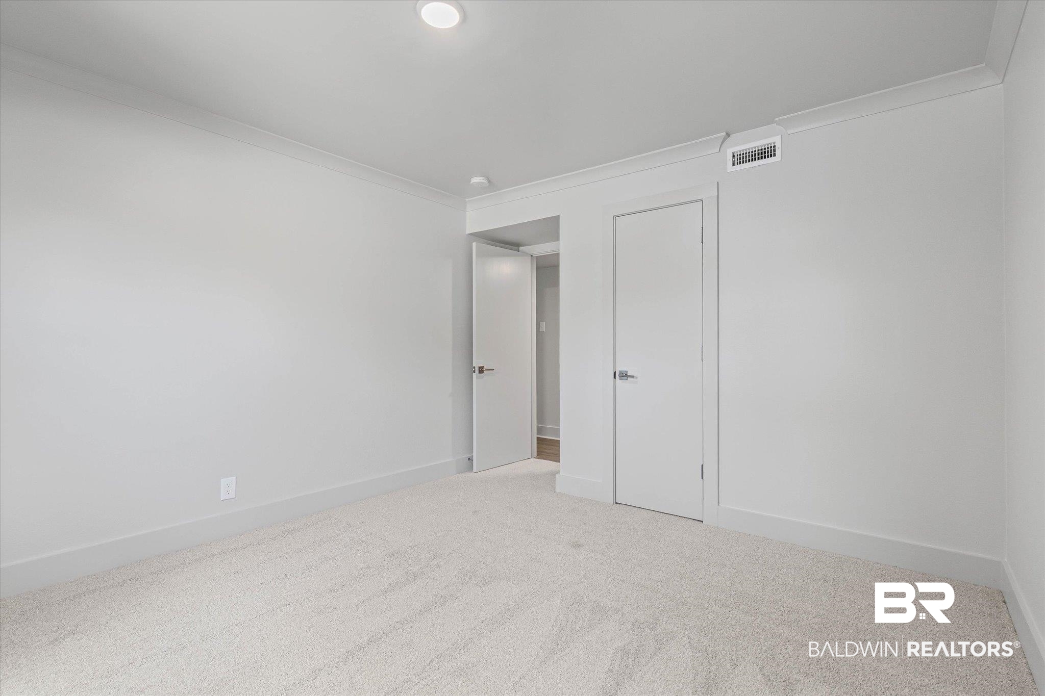 3655 Old Shell Road, Unit 712 Mobile, AL 36608 - Photo 13 of 19 Unfurnished bedroom with carpet flooring and crown molding