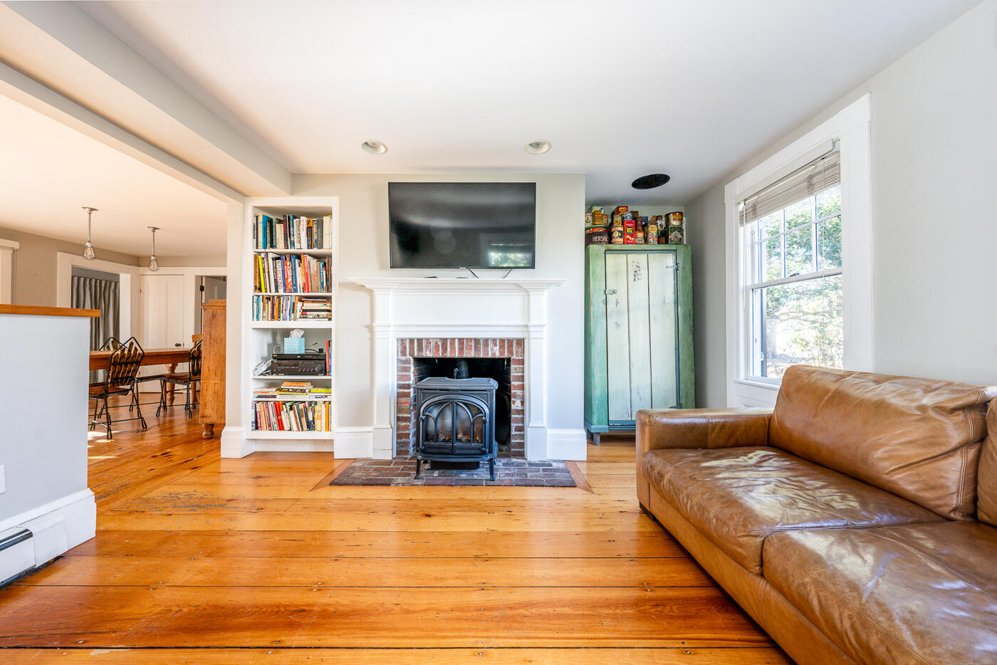 223 Main Street Wellfleet, MA 02667 - Photo 20 of 70 a living room with furniture fireplace and flat screen tv
