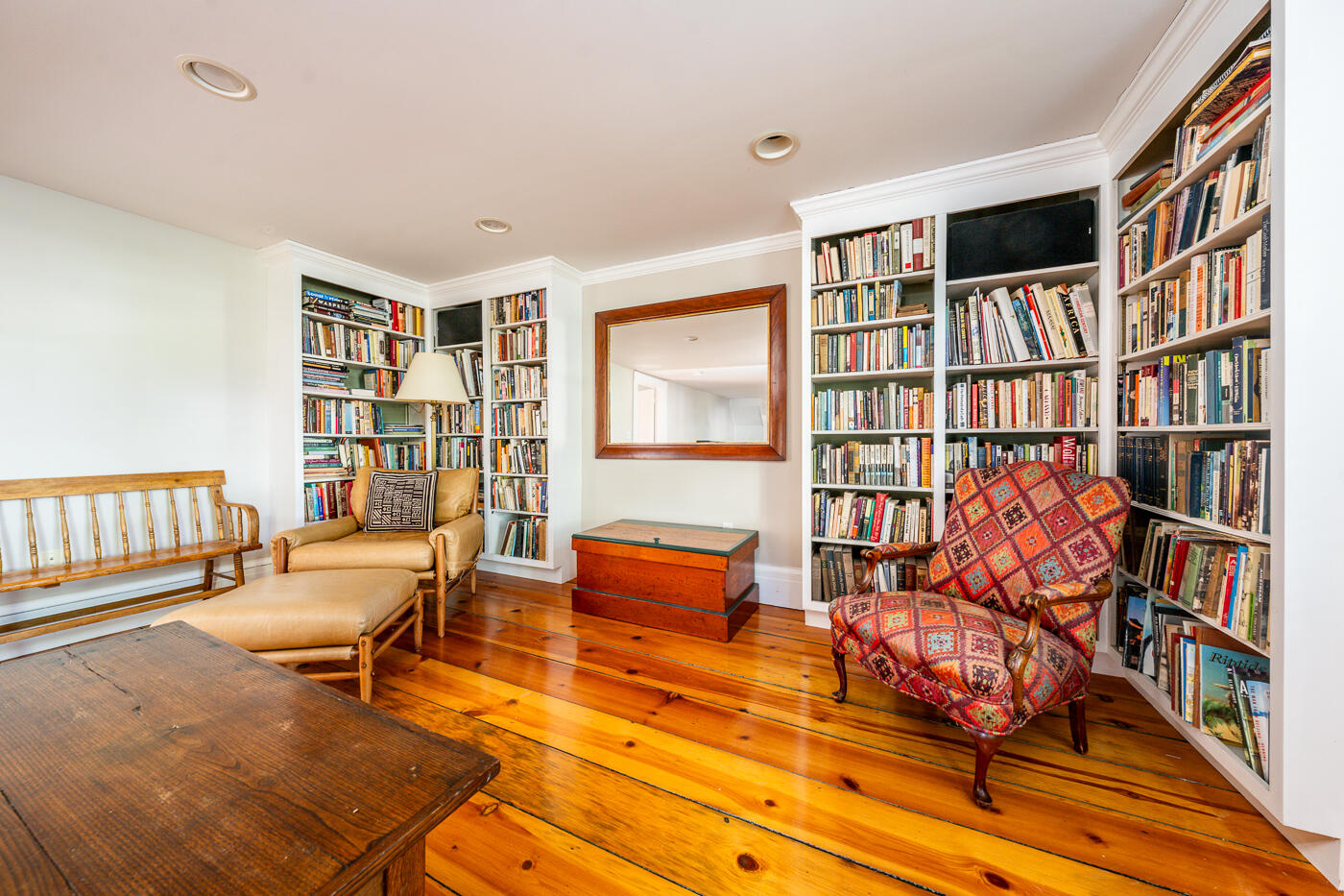 223 Main Street Wellfleet, MA 02667 - Photo 27 of 70 a living room with furniture a bookshelf and a bookshelf