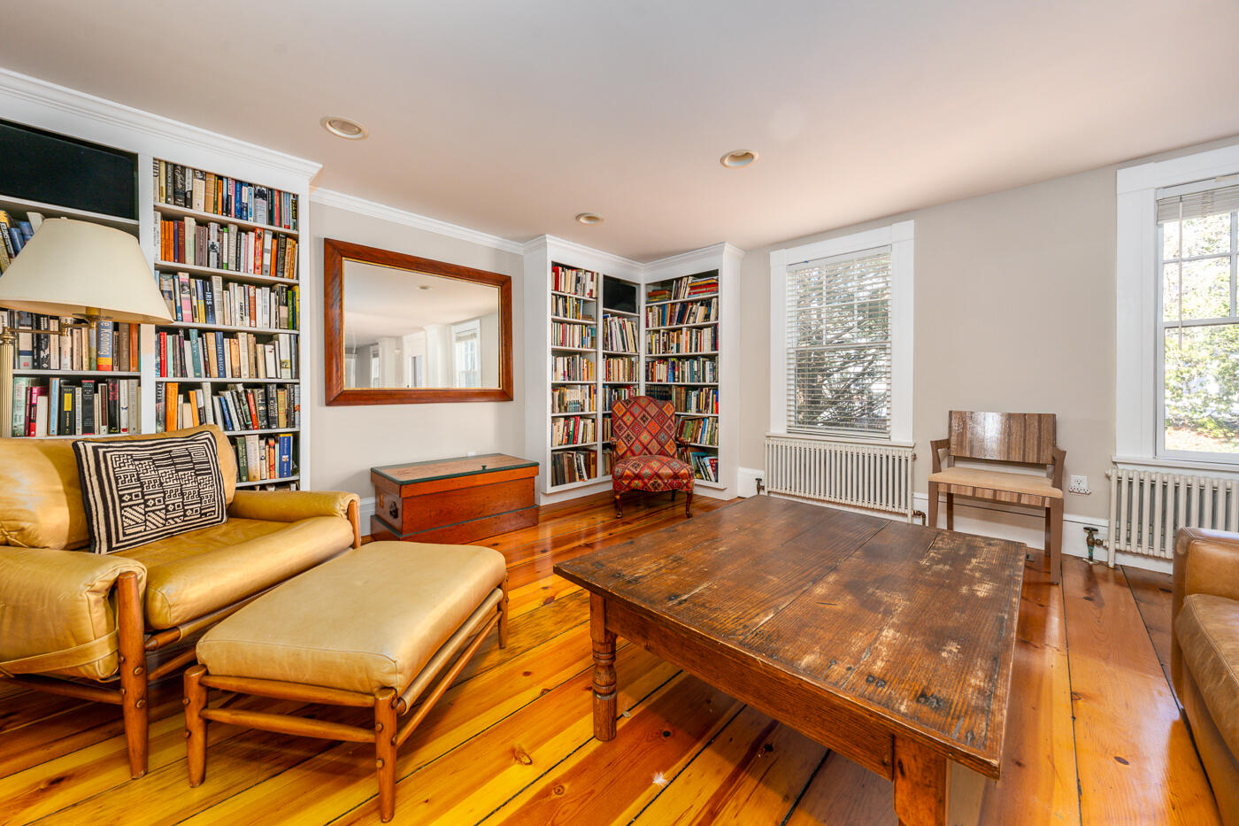 223 Main Street Wellfleet, MA 02667 - Photo 28 of 70 a living room with furniture a bookshelf and a window