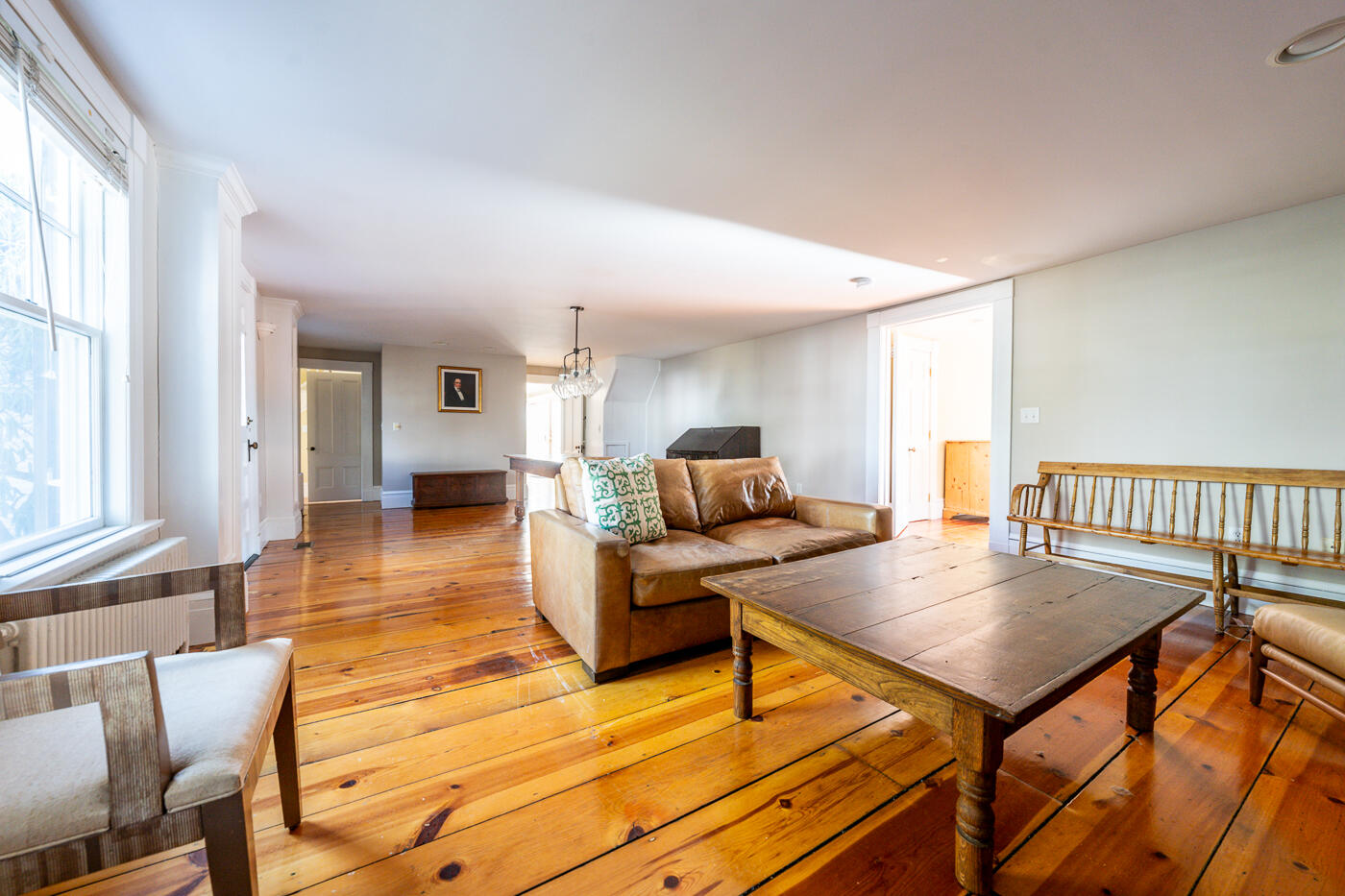 223 Main Street Wellfleet, MA 02667 - Photo 29 of 70 a living room with furniture a table and wooden floor